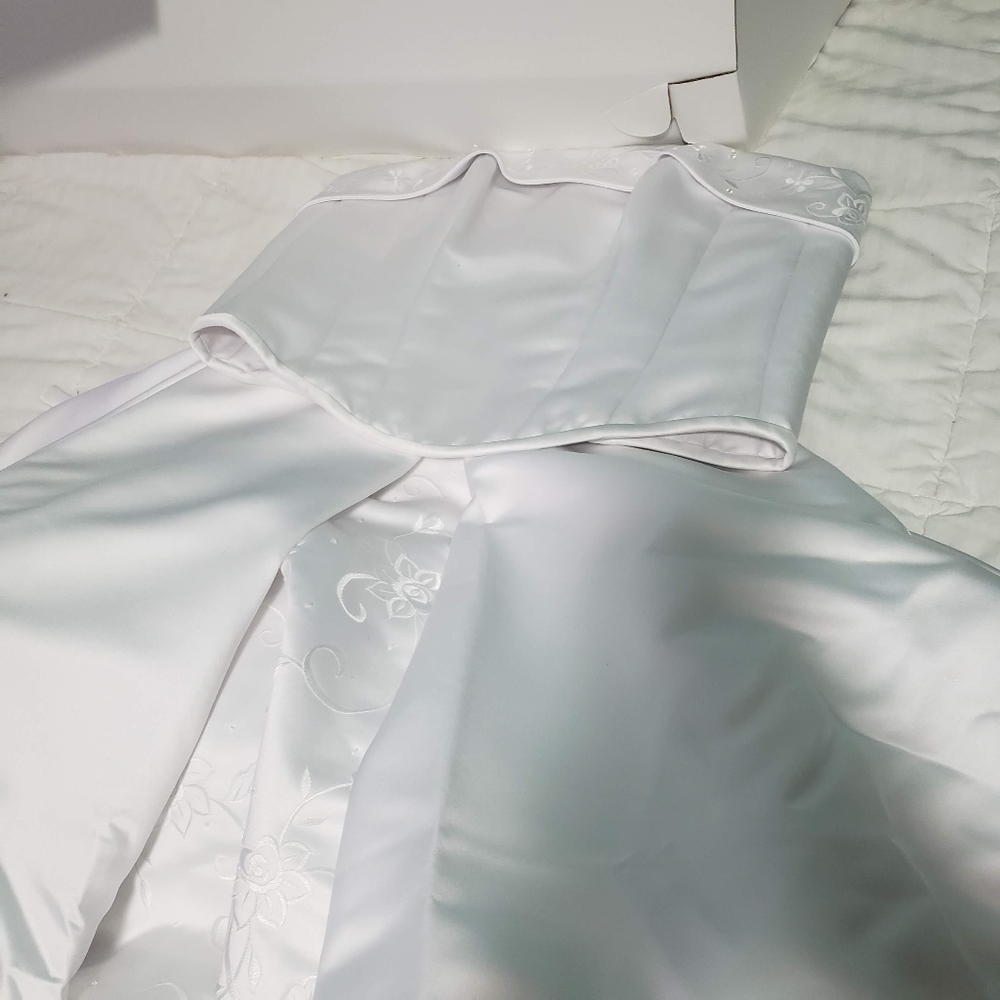 Wedding dress, satin with embroidered details.